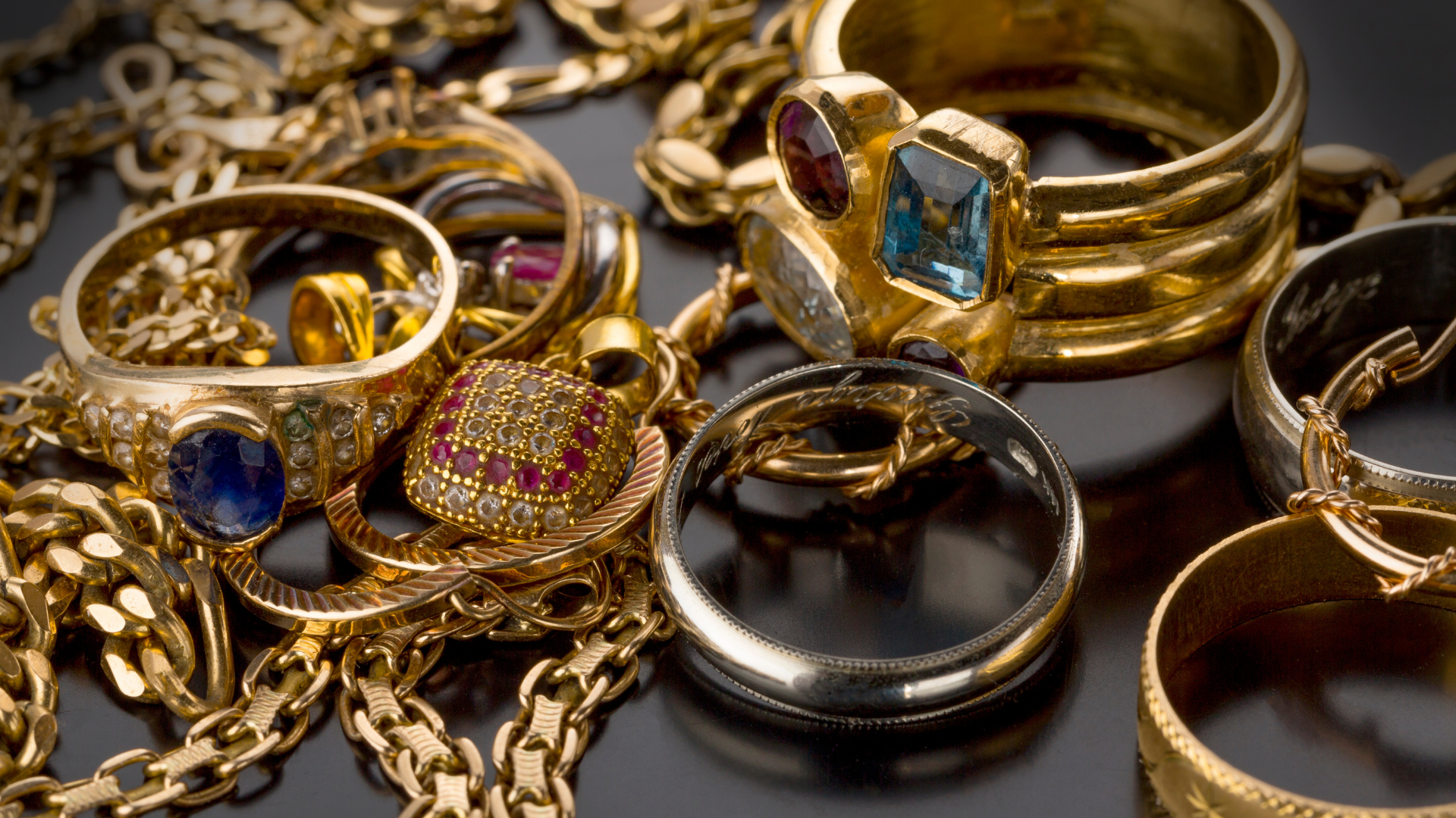Variety of gold jewelry with precious stones
